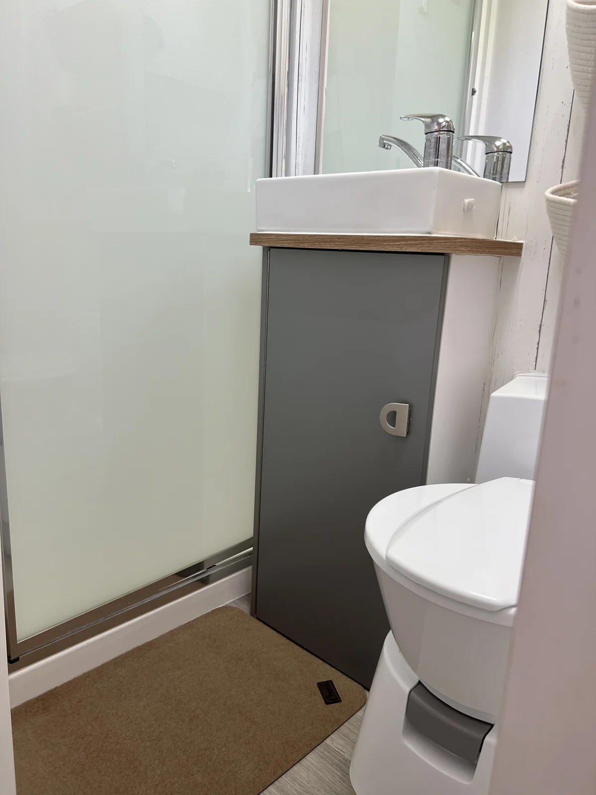 Pebble Conni mat on the caravan bathroom floor outside the closed shower